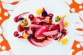 Modern French sweets:ÃÂ Close up strawberry mouse with merengue, rose, crumble & vanilla milk shake on white plate with red colour. Royalty Free Stock Photo